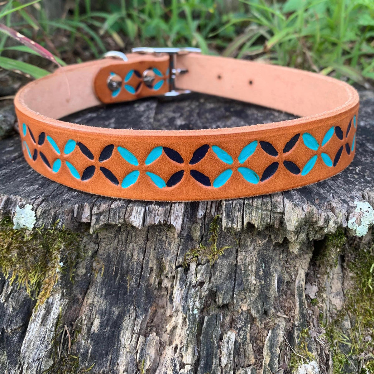 Colorful leather dog collar that is hand painted dark blue and teal.