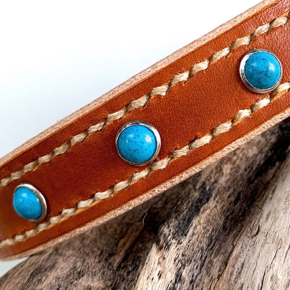 Leather pet collar with studs and hand stitching.