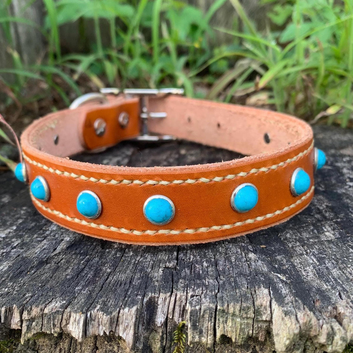 Leather pet collar with studs and hand stitching.