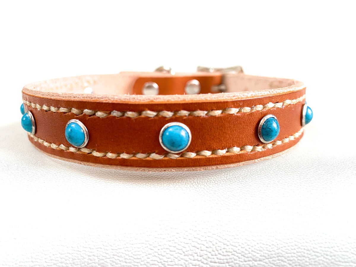 Leather pet collar with studs and hand stitching.