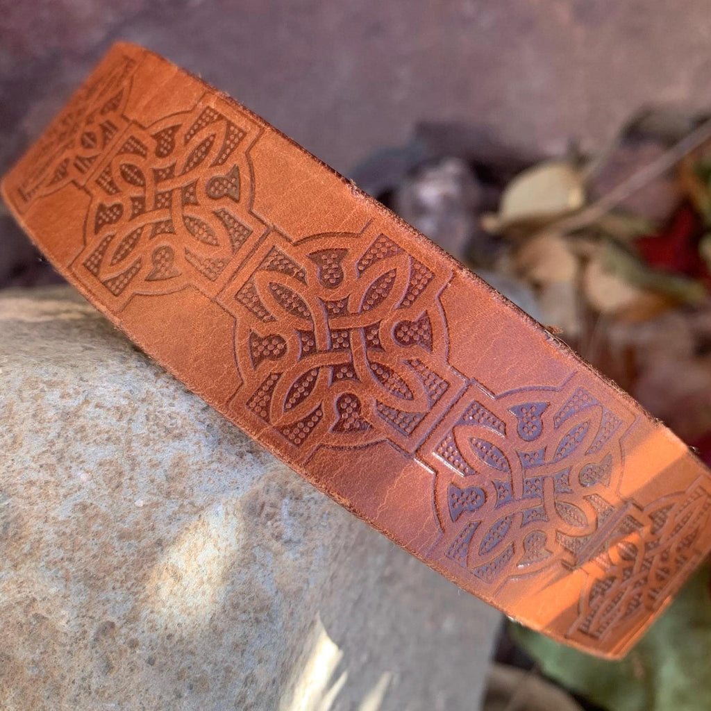 Brown leather collar with Celtic knots.